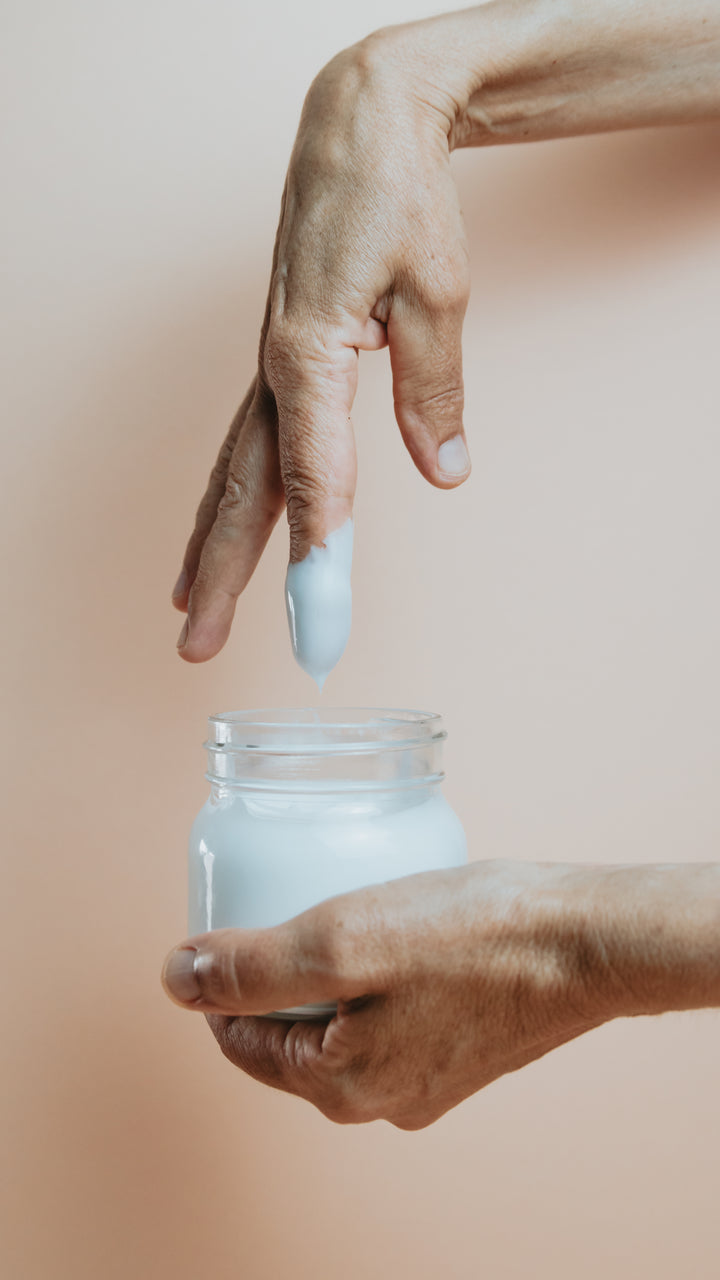 Preview frame 4: a hand beside a glass jar of hand cream